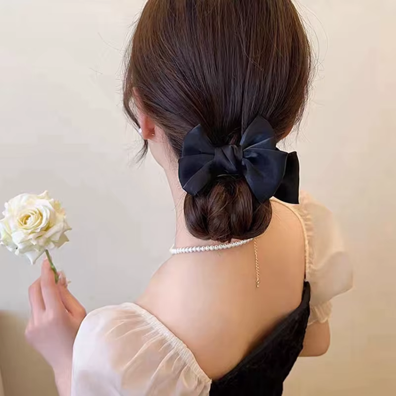 Pince à cheveux élégante pour chignon avec nœud papillon